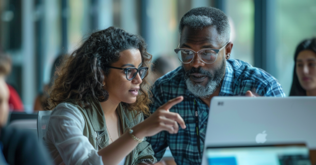 woman and man troubleshooting at computer